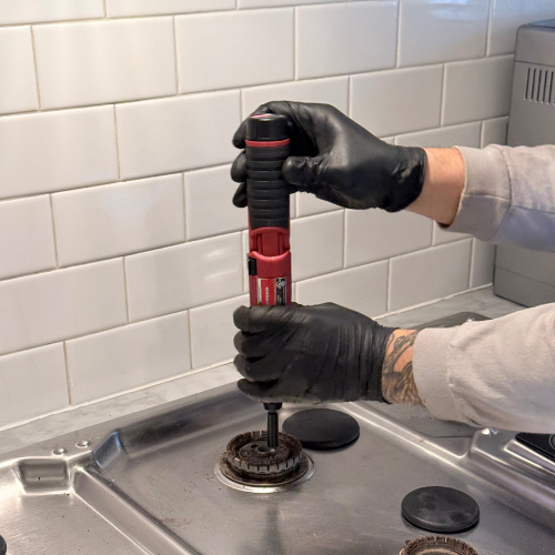 Yellow piggy bank with a gold coin featuring a dollar sign.