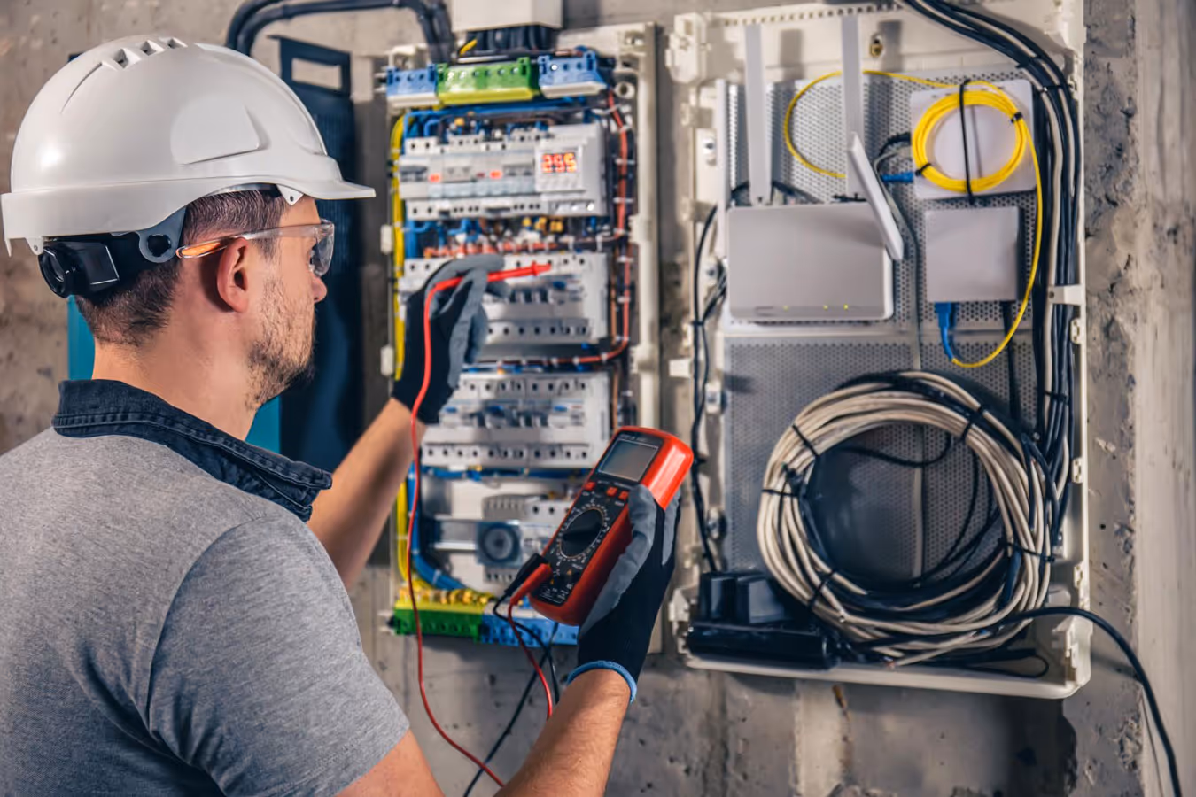 Sunshine Services electrician inspecting and testing electrical circuits with multimeter in Florida
