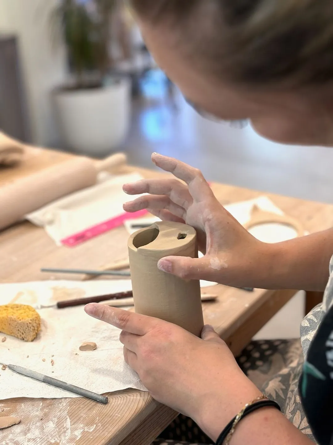 Zoomed in shot of someone working on pottery