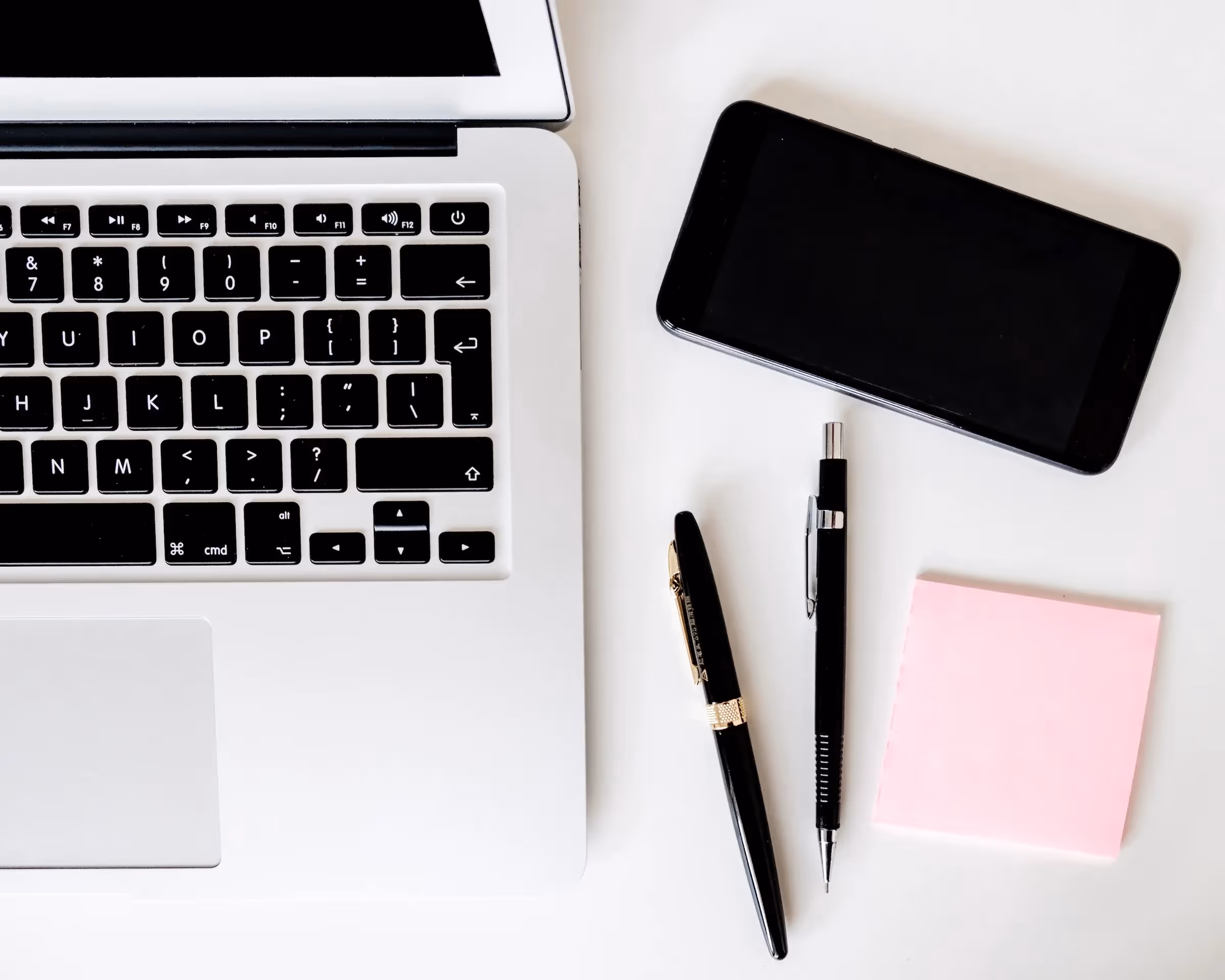 Sober and clean workspace with useful tools (computer, mobile...)