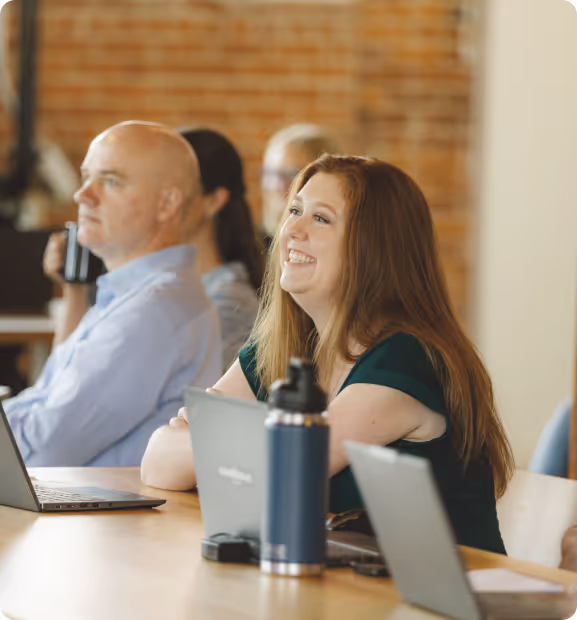 Pairwise team members in collaborative office environment during meeting