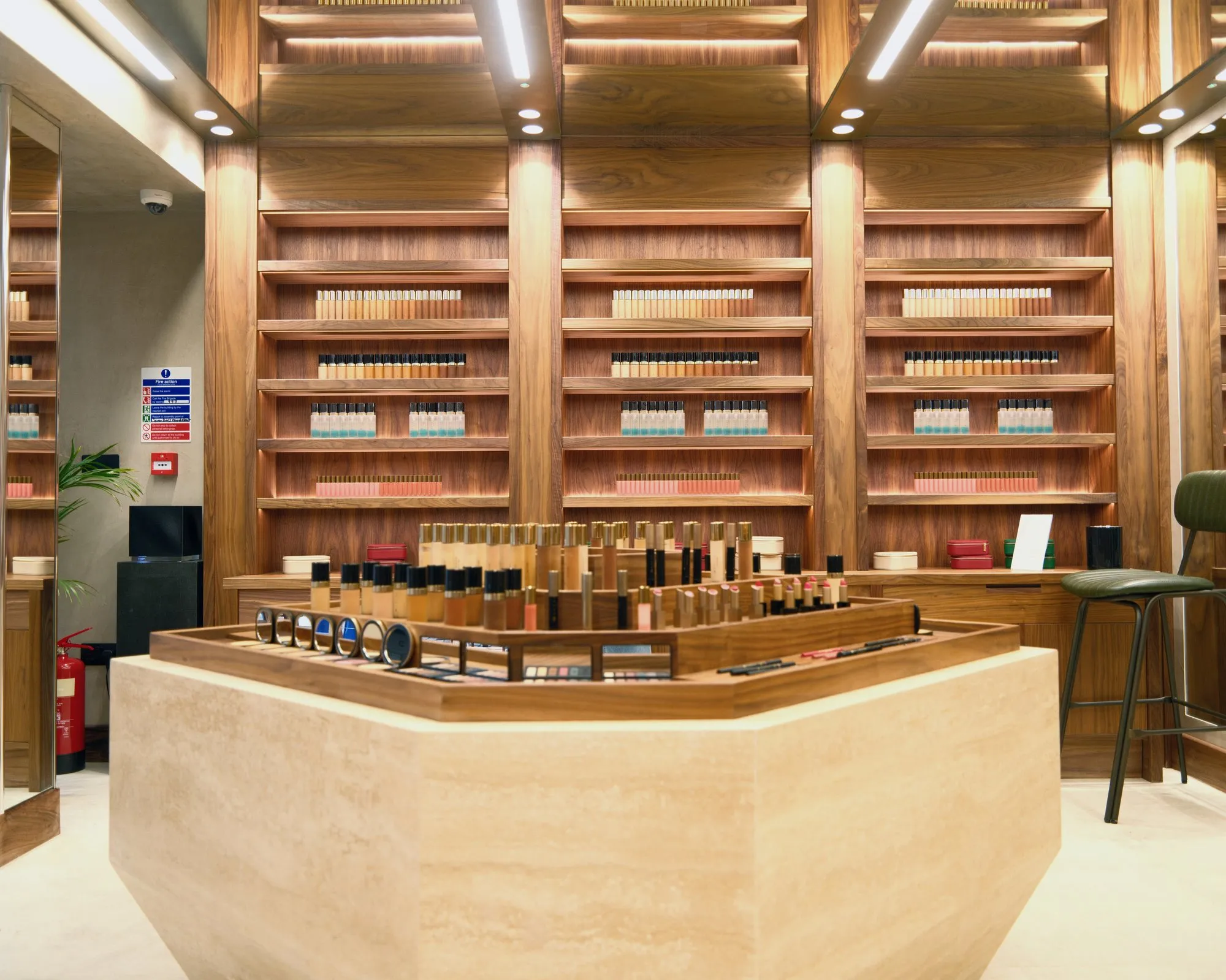 Monmouth Street walnut display shelving and travertine counter