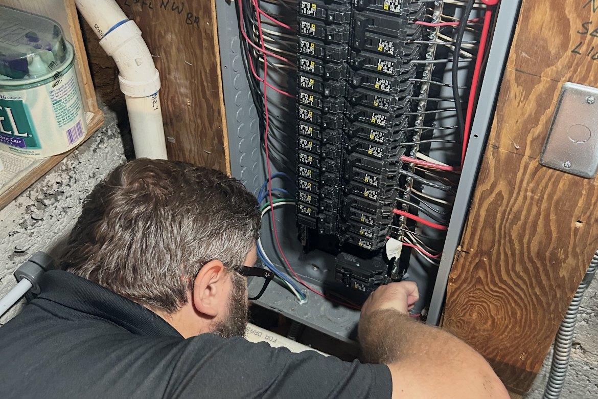 Good Guys electrician Richard working inside a residential electrical panel