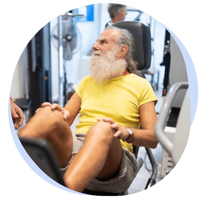 Older man on exercise equipment