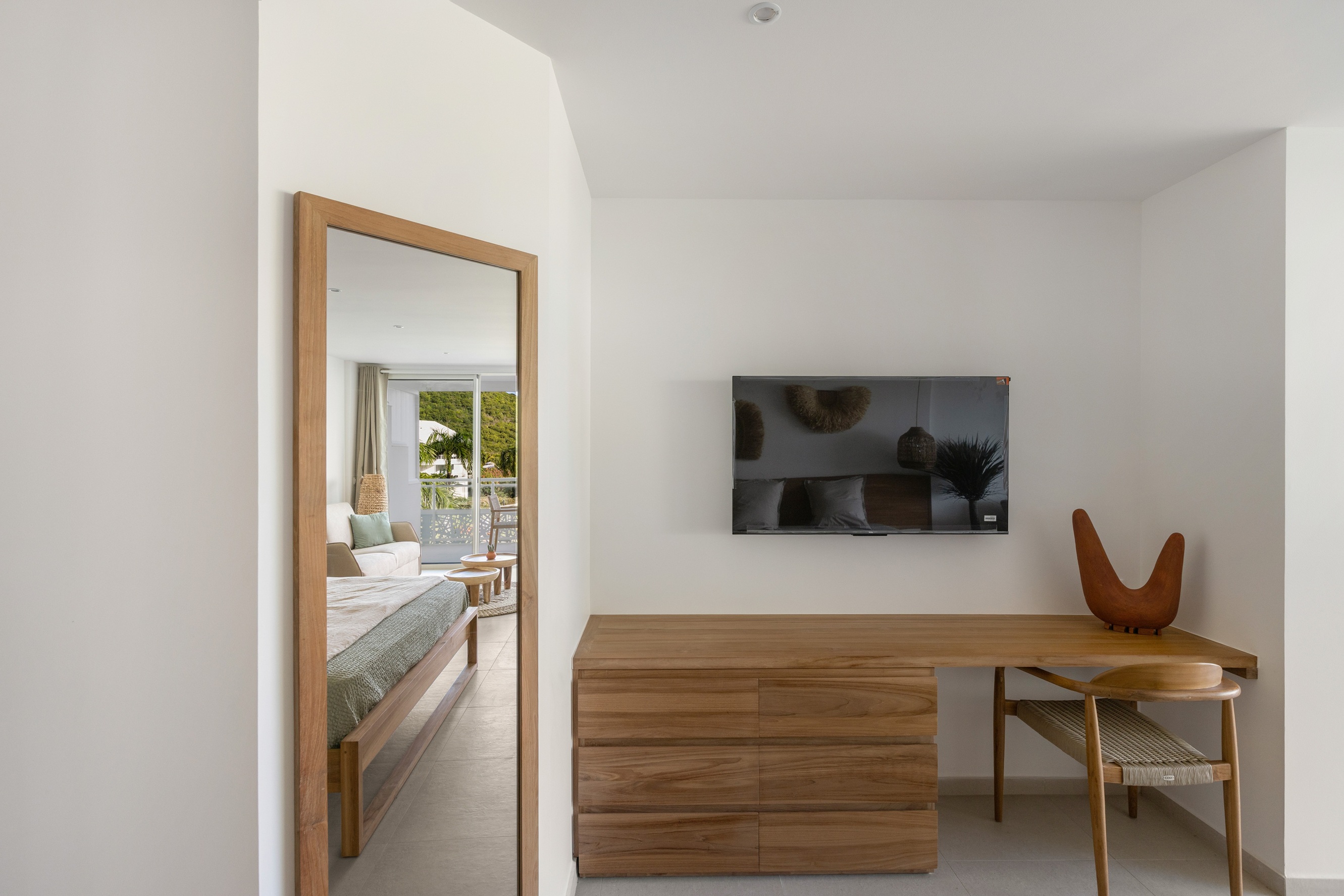 Chambre confortable avec grand lit et ambiance apaisante à l’hôtel Anse Marcel