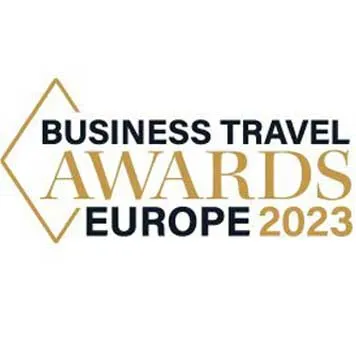 Logo for the Business Travel Awards Europe 2023, featuring gold and black text with a diamond design.