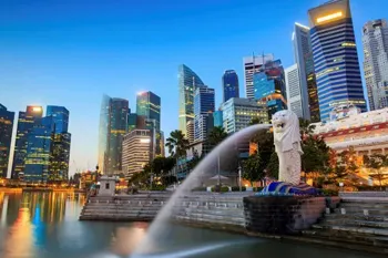 Singapore skyline with the iconic Merlion statue and modern skyscrapers at Marina Bay.