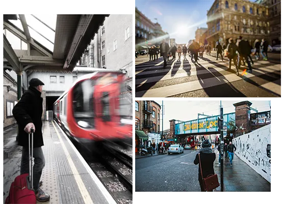 A traveler waits at a train station, with bustling city streets and markets in the background.
