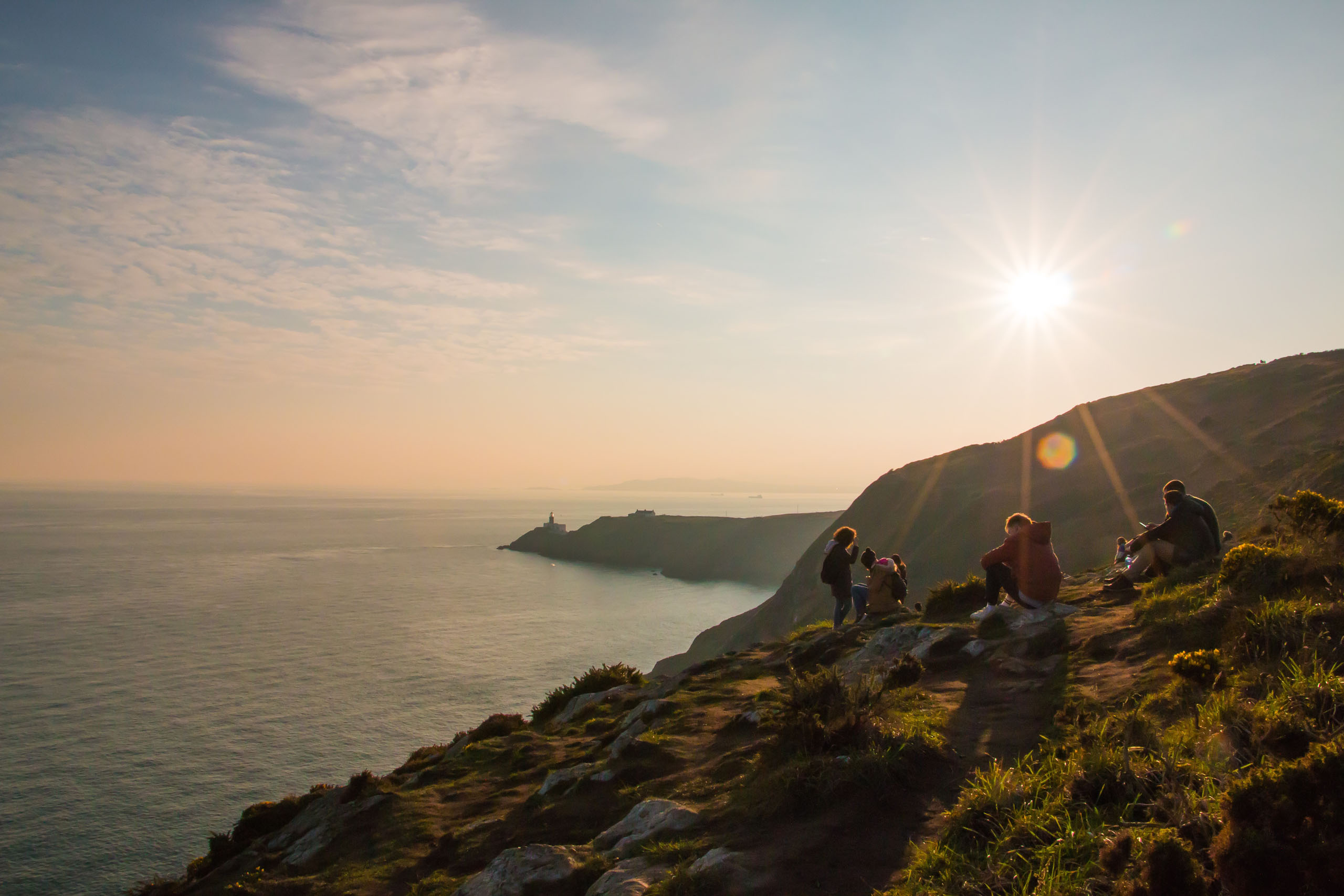 people enjoying time on cliffs looking out on the ocean