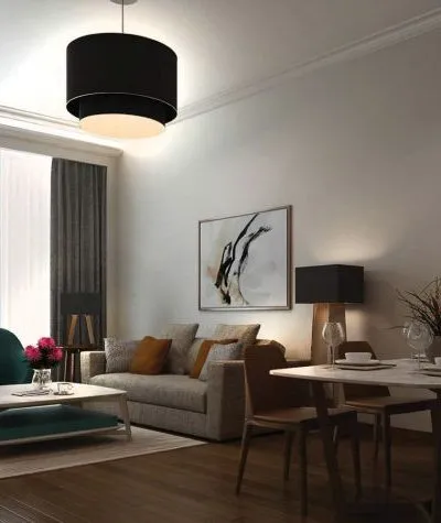 Modern living-dining area with neutral tones, abstract art, and contemporary lighting.