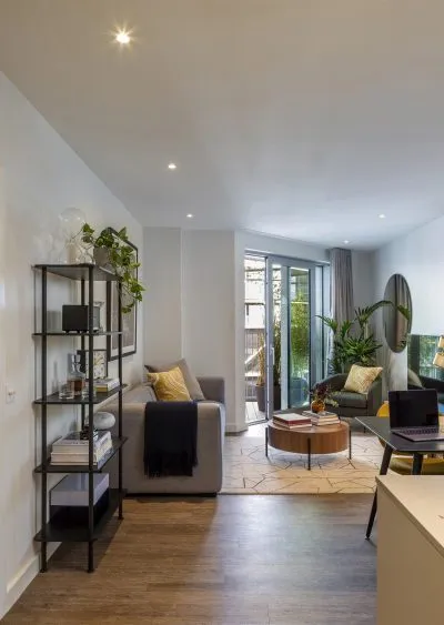 A modern living space with sleek furniture, natural light, and a cozy, minimalist design.