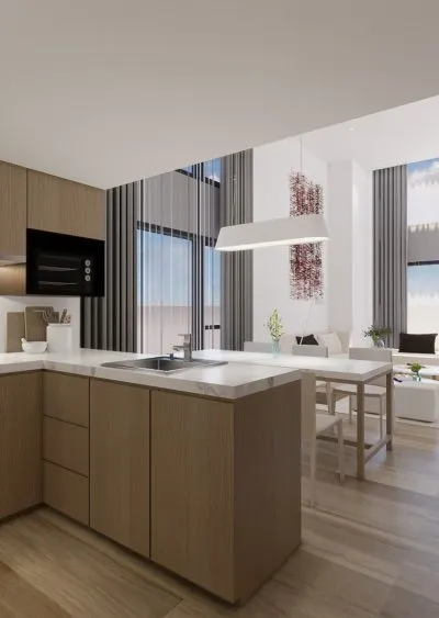 Modern kitchen with wood cabinetry, island, pendant lighting, and open living area in the background.