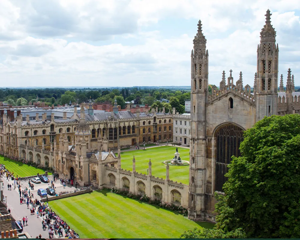 King's College Chapel and courtyard at the University of Cambridge, surrounded by historic architecture.