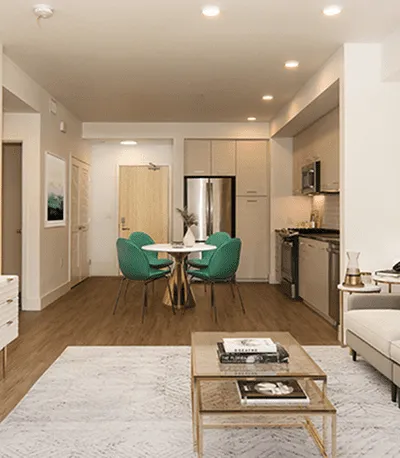Modern open-concept living space with a kitchen, dining area, and stylish furnishings.