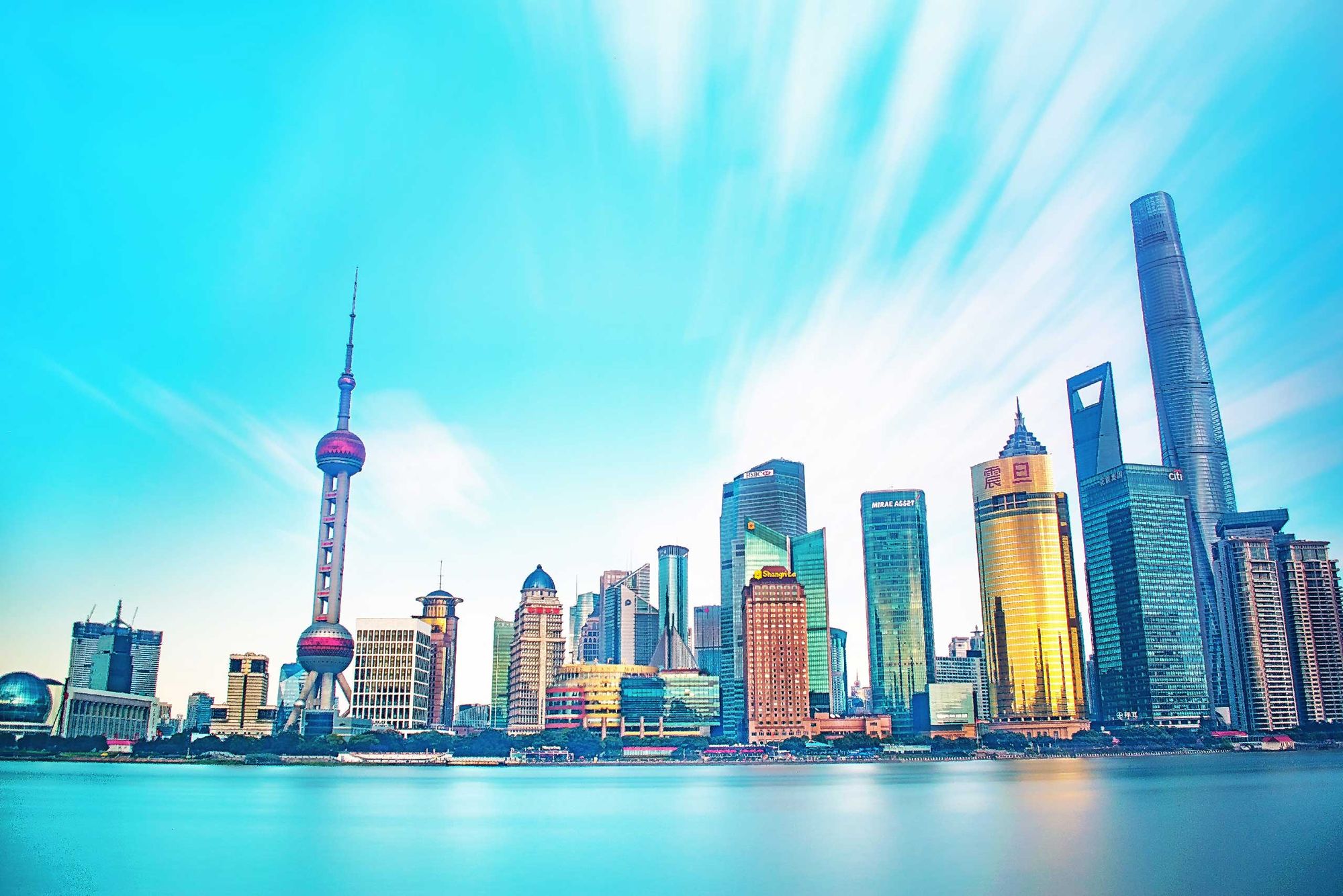 Shanghai skyline featuring modern skyscrapers and the iconic Oriental Pearl Tower.