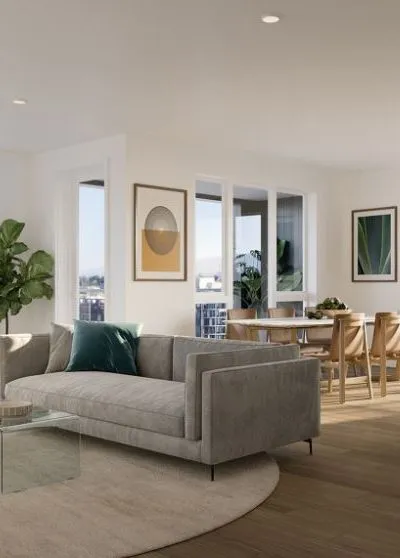Modern living room with minimalist decor, neutral tones, and abundant natural light.