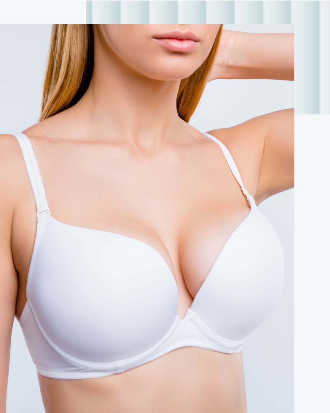 A close-up image of a woman wearing a white bra, showcasing a smooth design and adjustable straps.