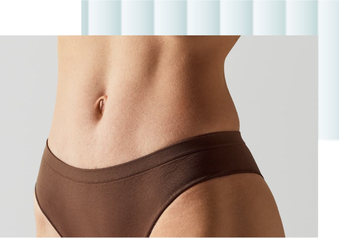 A close-up of a person's midsection wearing brown underwear, showcasing a smooth abdomen and hip area.