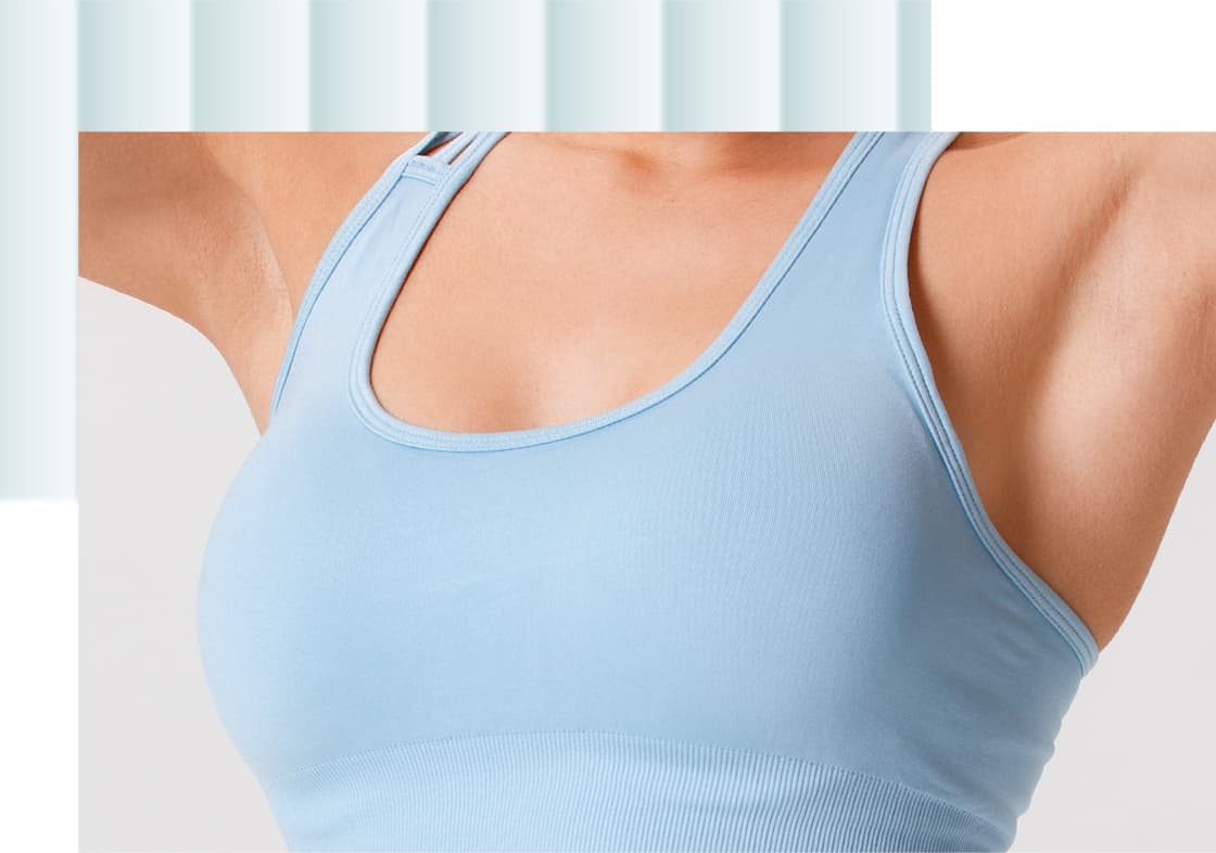 A person wearing a light blue athletic tank top, showcasing the upper torso and arms. The fabric appears fitted and smooth, emphasizing a sporty style.