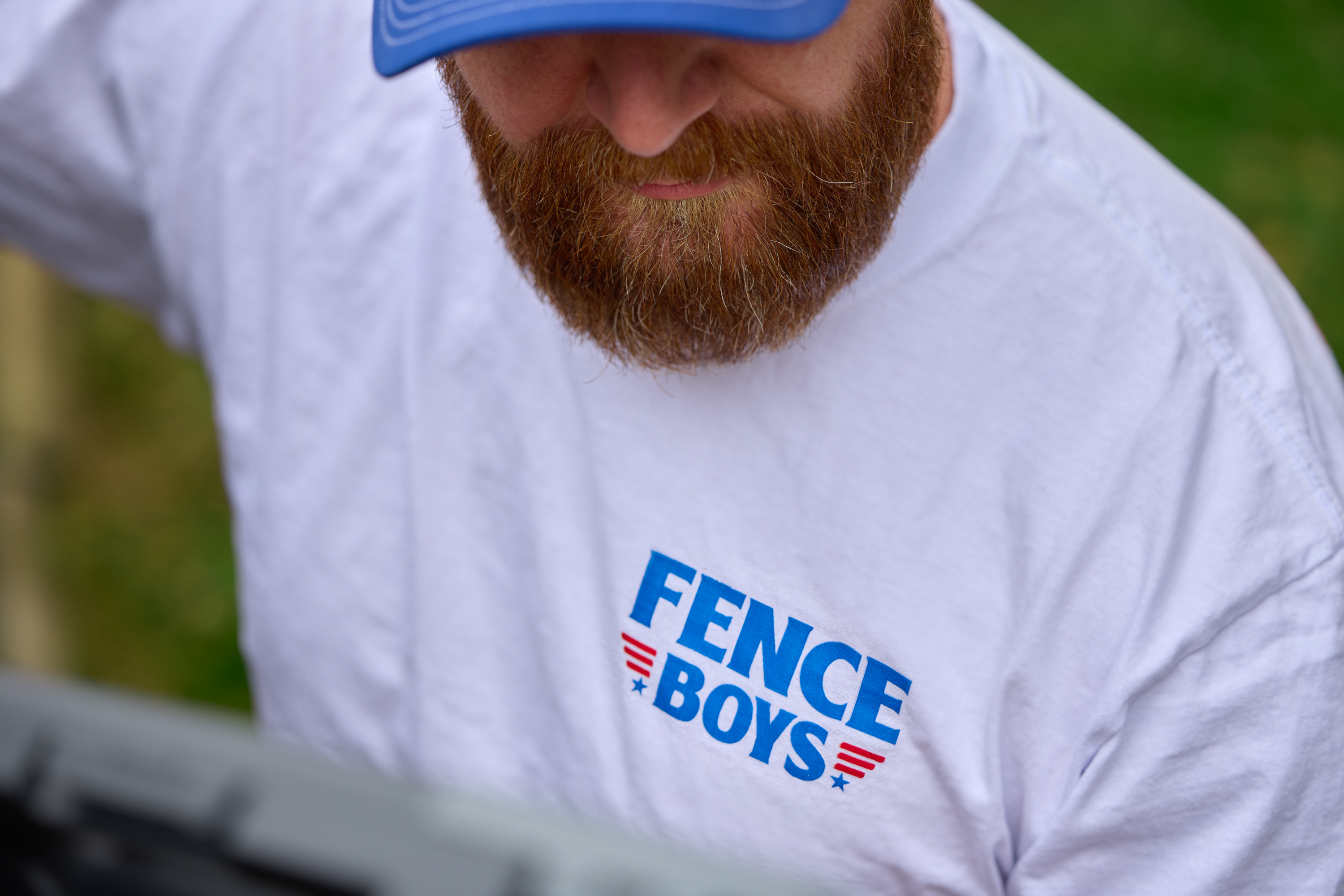 Fence Boys crew member working on a residential wood fence installation in Columbus