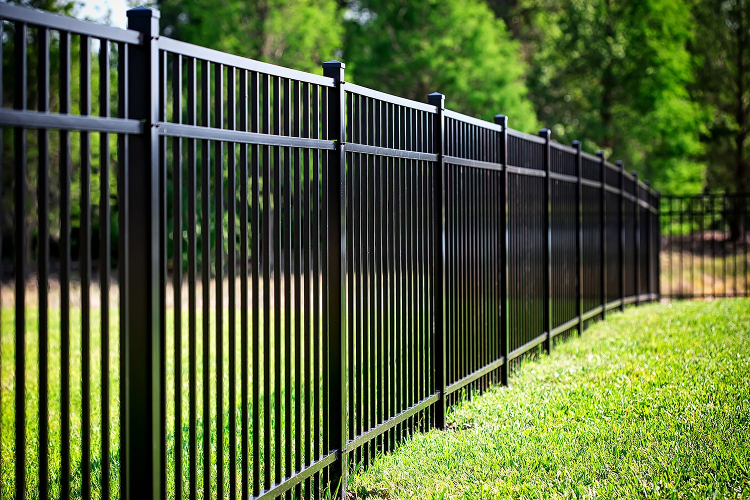 Black aluminum decorative fence surrounding a Columbus property