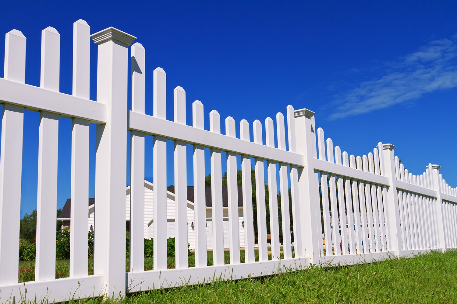 White vinyl privacy fence installed along a Columbus residential property
