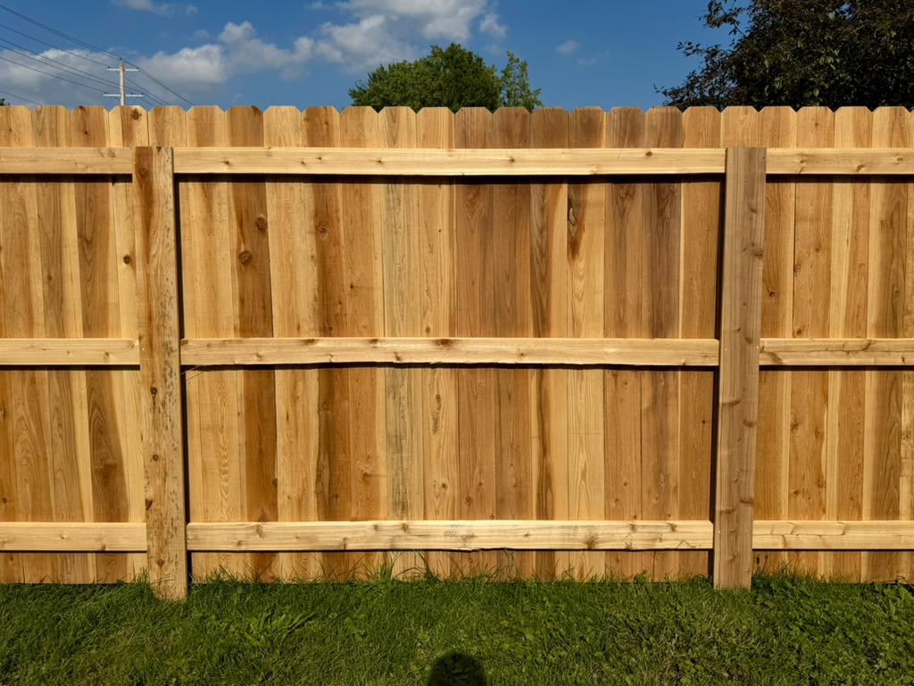 New cedar privacy fence with wood fence panels.