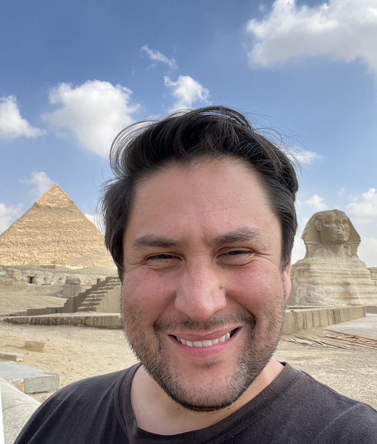 Harvey Droke in front of pyramids.