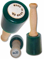 Three green measuring cups with wooden handles and dial, displayed together