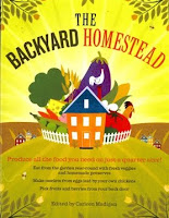 Colorful illustrated cover of "The Backyard Homestead" book featuring a red house surrounded by vegetables and nature.