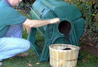Person sitting on ground near teal tent and wooden bucket outdoors