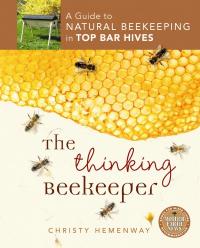 Book cover about natural beekeeping and top bar hives with honeycomb and bees