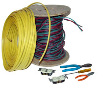 Coiled yellow and multicolored electrical cables with connectors and testing tools