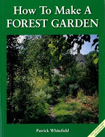 Book cover showing a lush forest garden with dense green vegetation and trees