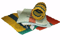 Rolls of colorful duct tape arranged on white surface with magnifying glass