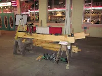 Wooden workbench with tools in industrial workshop or garage setting