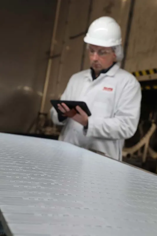 person holding smart device for service+ support and training