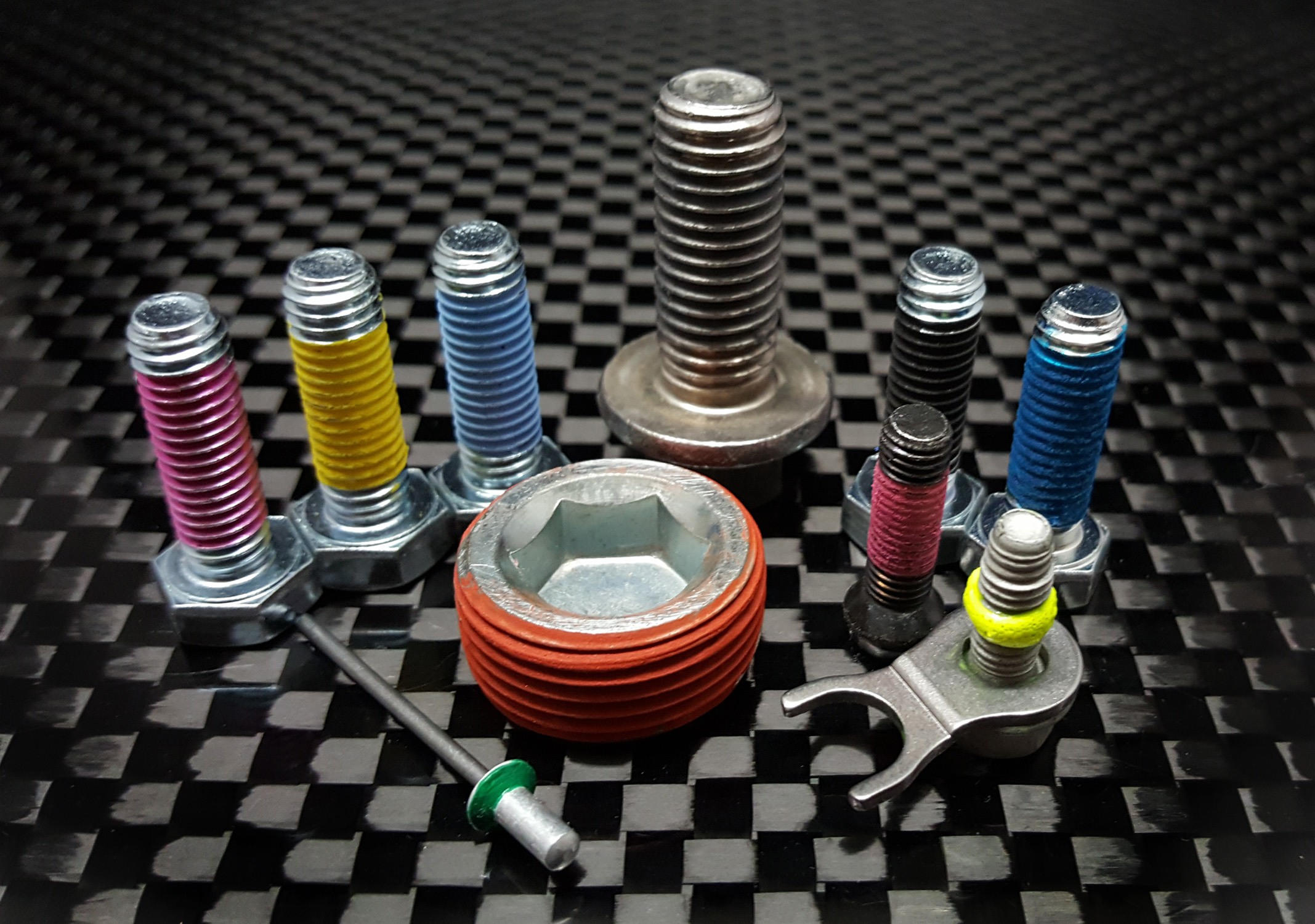 Fasteners coated with various Tectorius materials