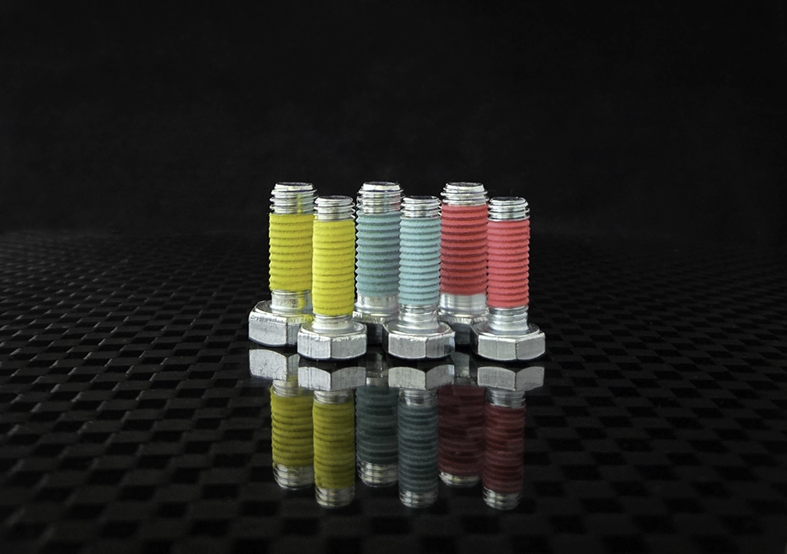 Color-coded pre-applied fastener coatings
