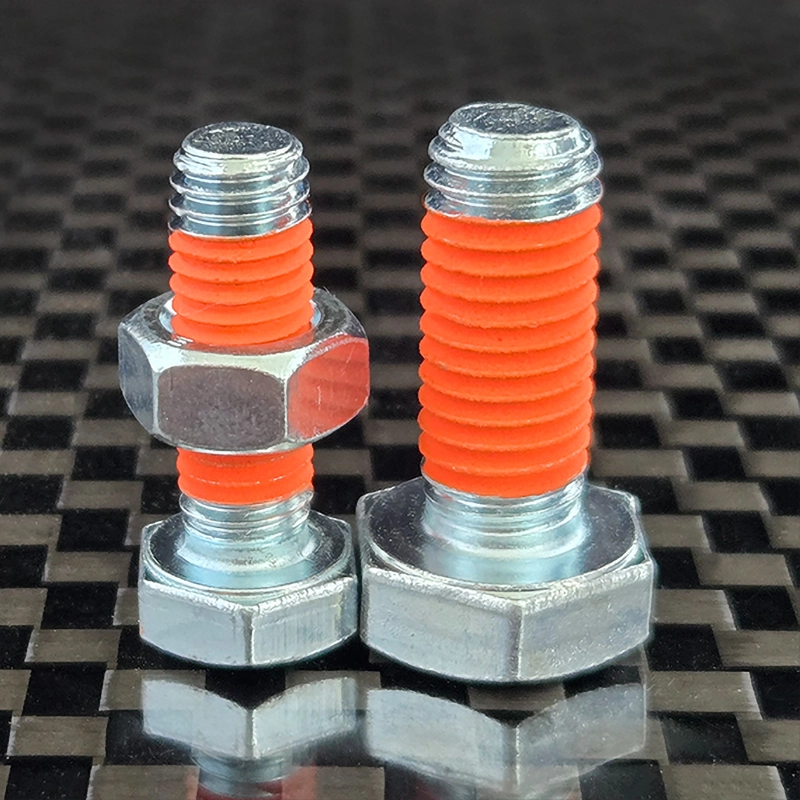 2 bolts coated with Tec Bond 251 Orange
