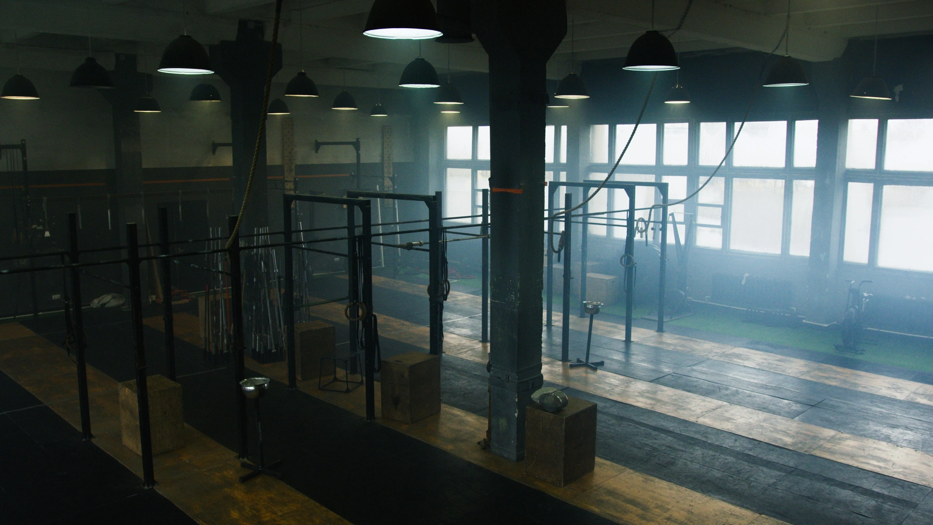 A spacious gym at CrossFit 812 in Vincennes, IN, filled with various fitness equipment for diverse workouts.