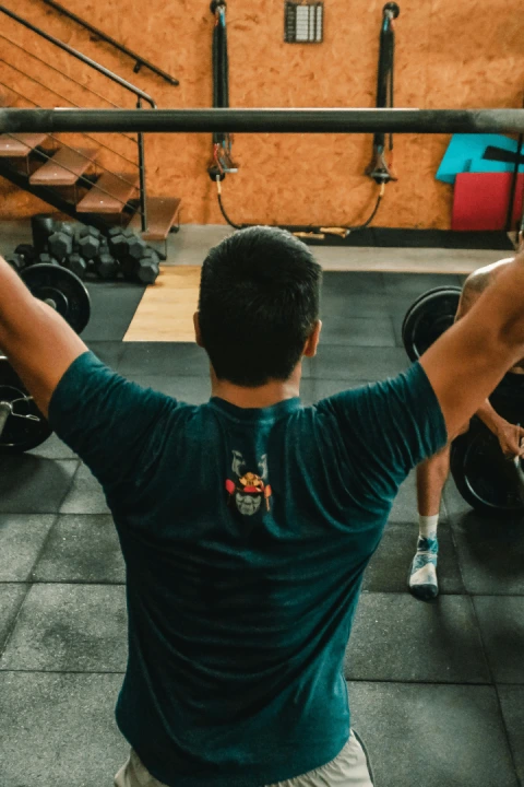 A man lifting a barbell during a CrossFit session at CrossFit 812 in Vincennes, IN.