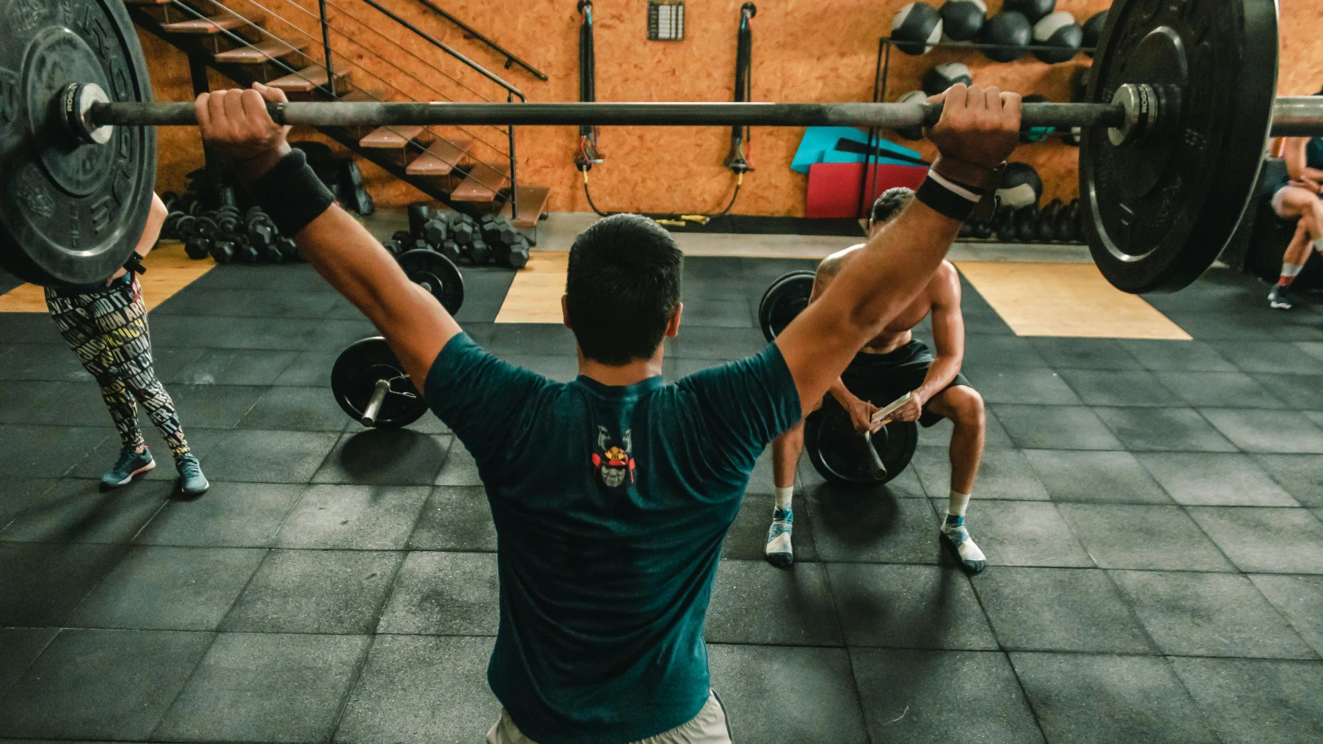 A man lifting a barbell during a CrossFit session at CrossFit 812 in Vincennes, IN.