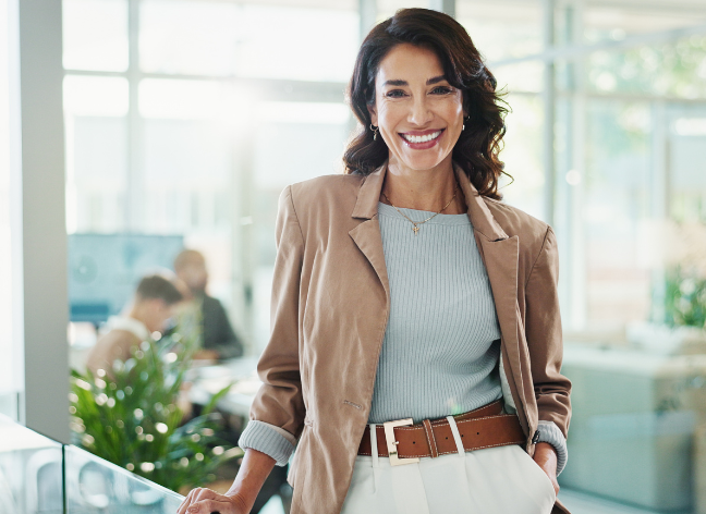 Confident female executive in modern office, representing leadership, client success, and professional partnership