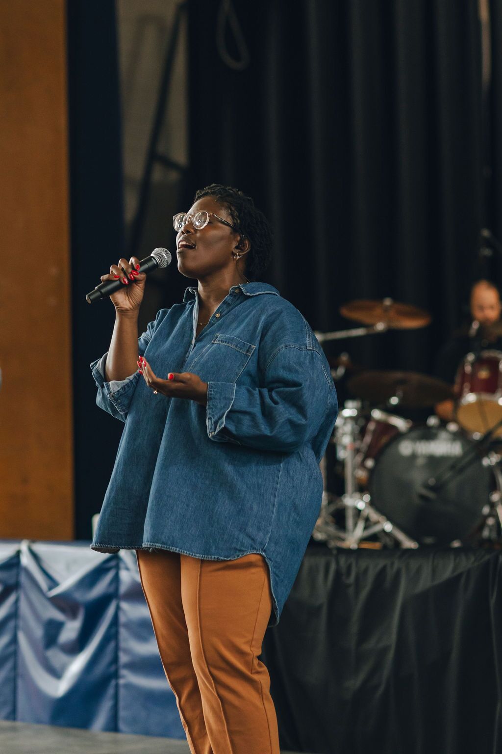A woman singing on a stage