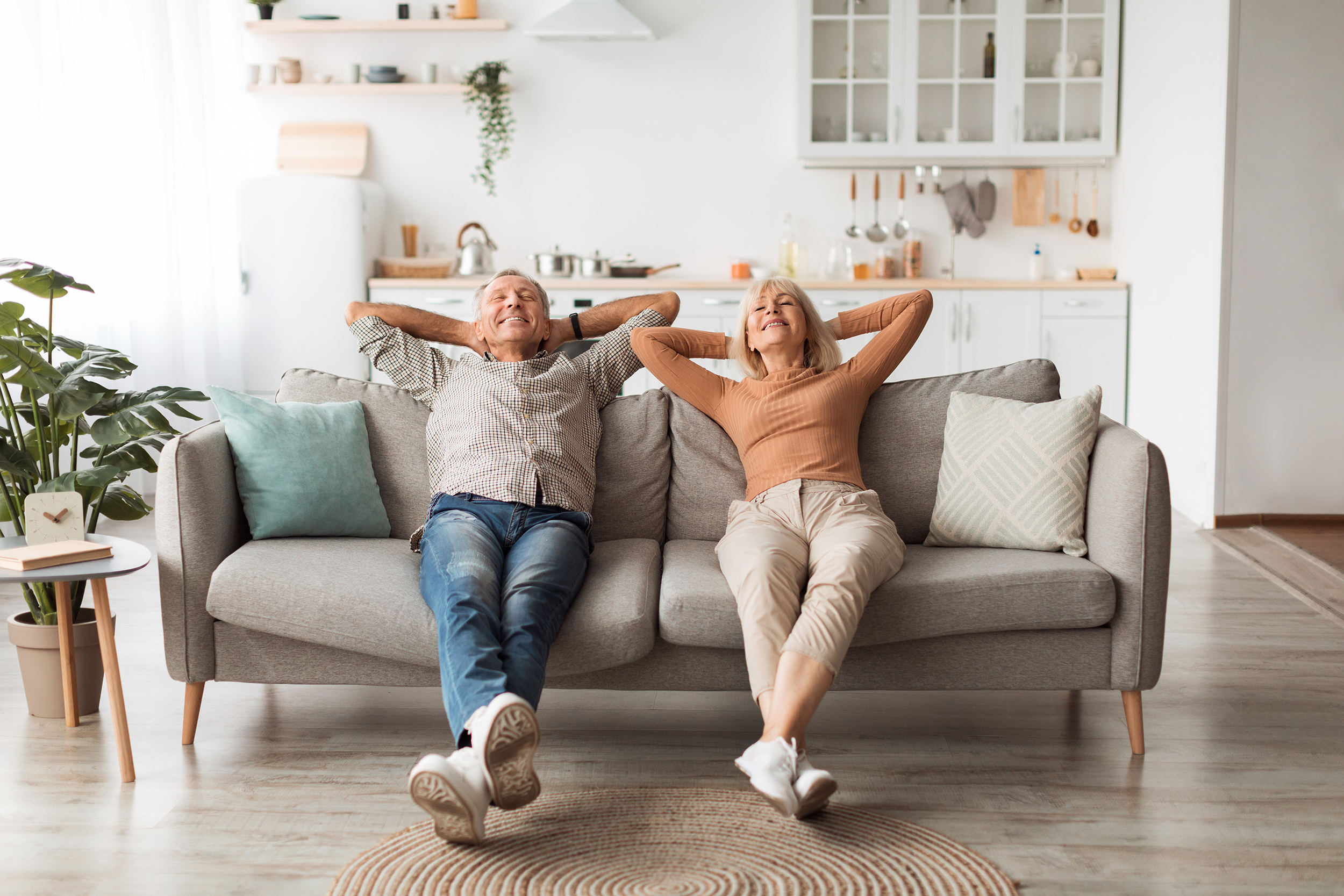 An older couple sits on the couch at home. What retirement income is tax-free? Roth accounts, HSAs, municipal bonds, the home sale exclusion, the 0% capital gains bracket, and the catch with each.