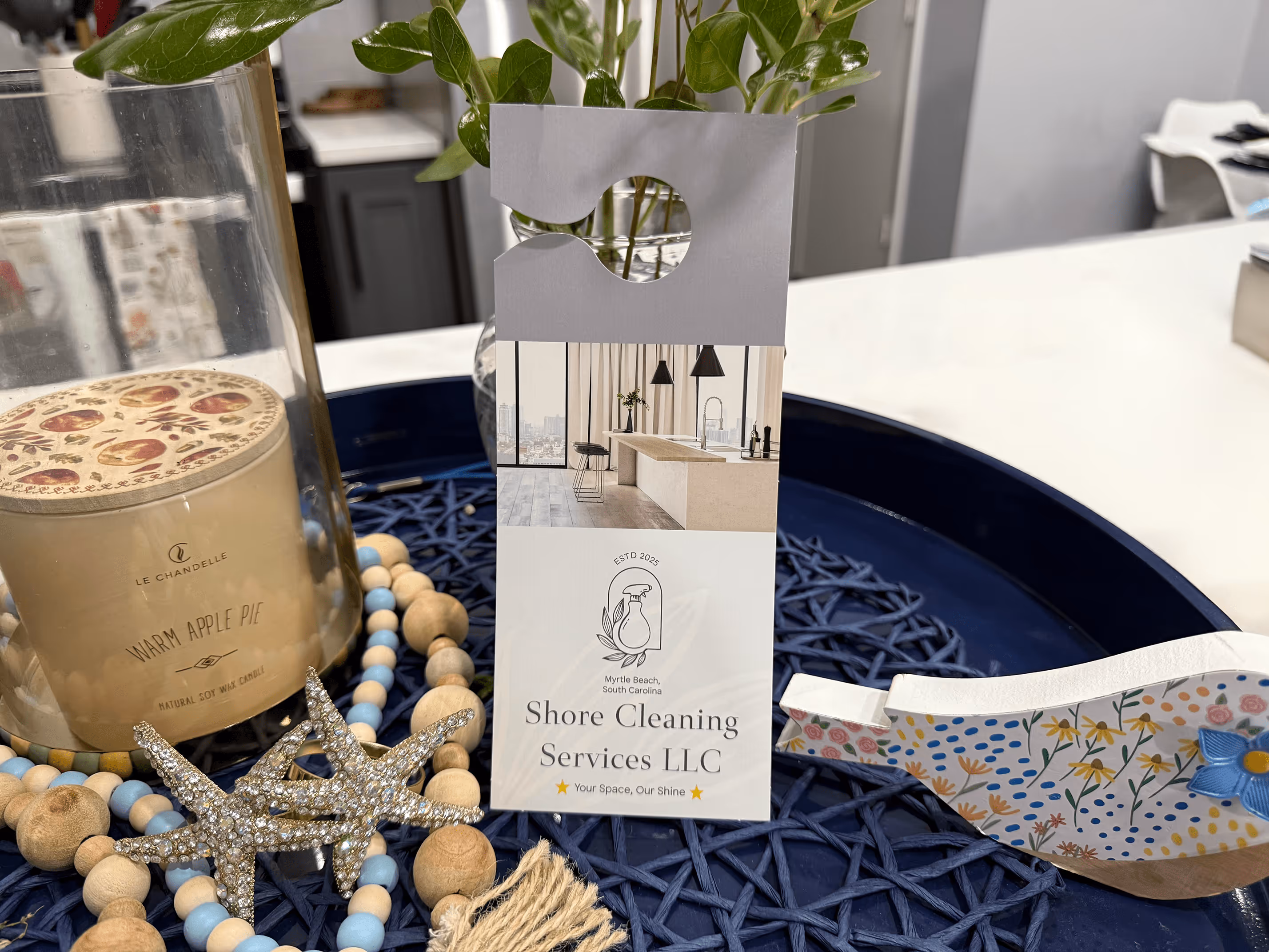 Shore Cleaners set up display. Shore themed with sea star, candle, and blue tones.