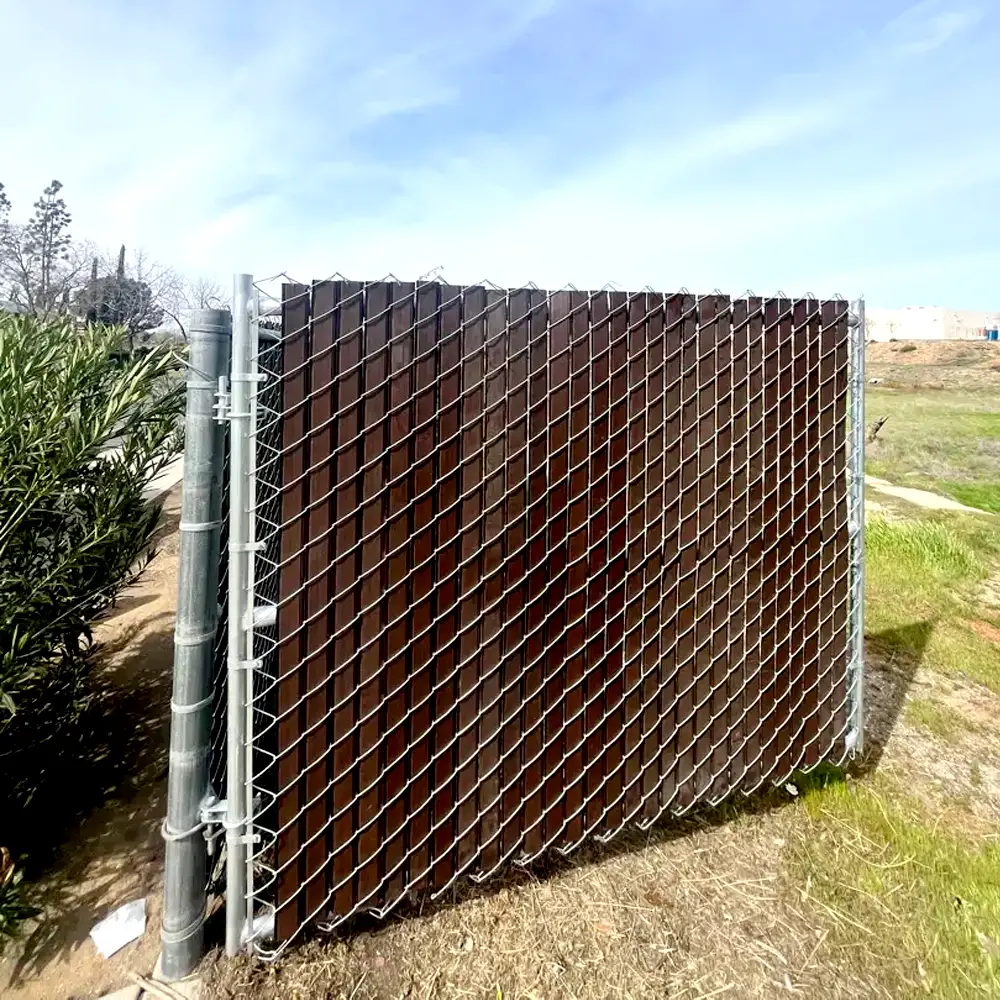 A sturdy looking wood and metal fence.