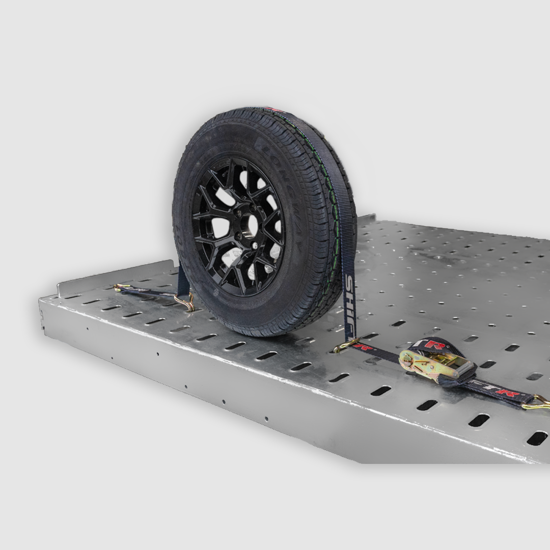 Over-tire SHIFTR tie-down straps for vehicle transport security