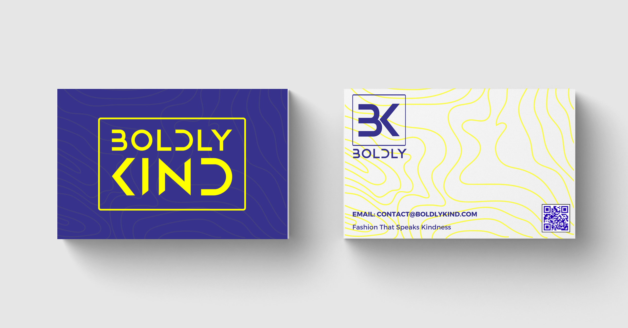 Boldly Kind Apparel brand stationery including logo and business card with signature yellow and violet palette